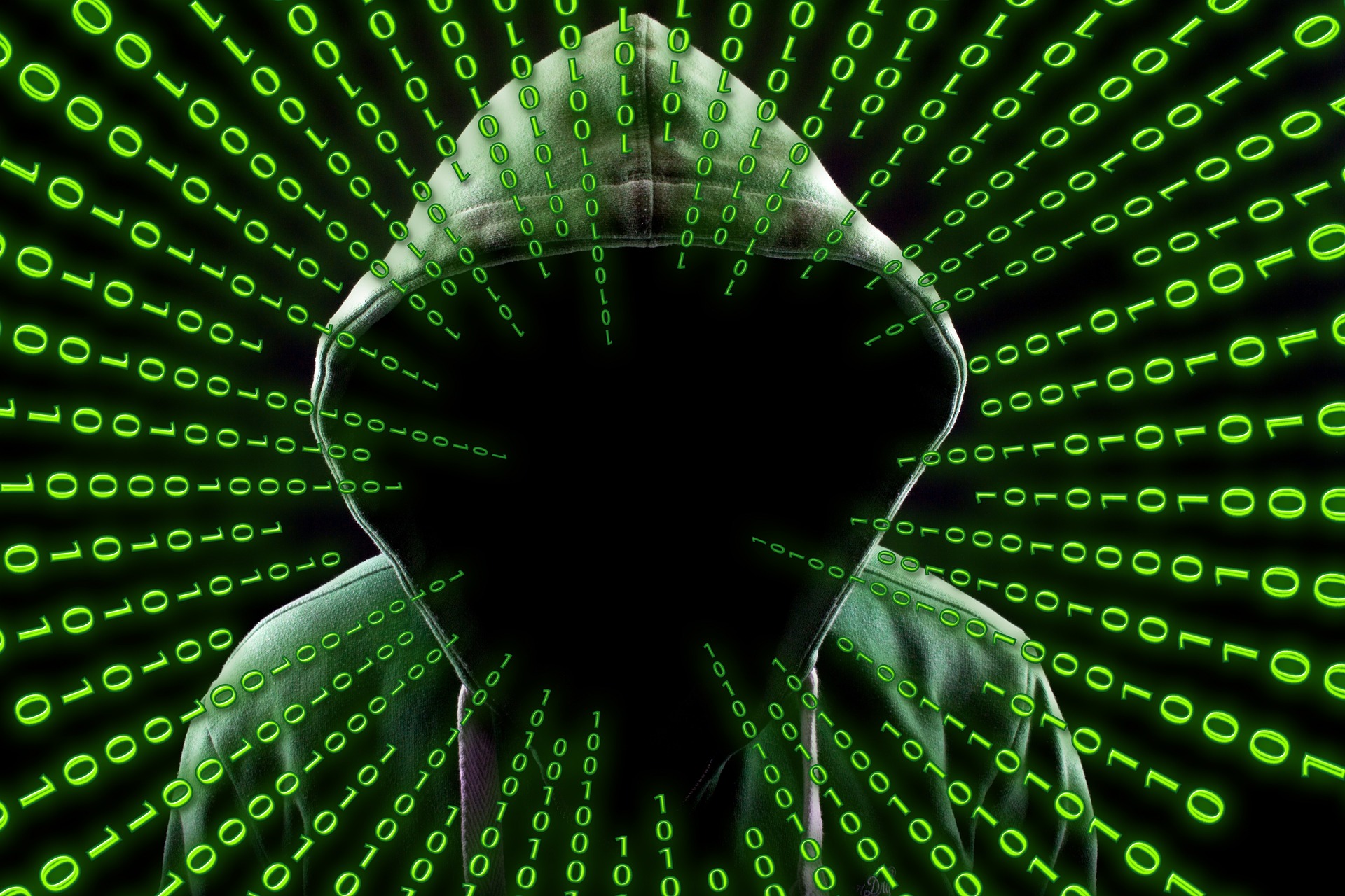 Hooded Hacker in Matrix Style Green Code